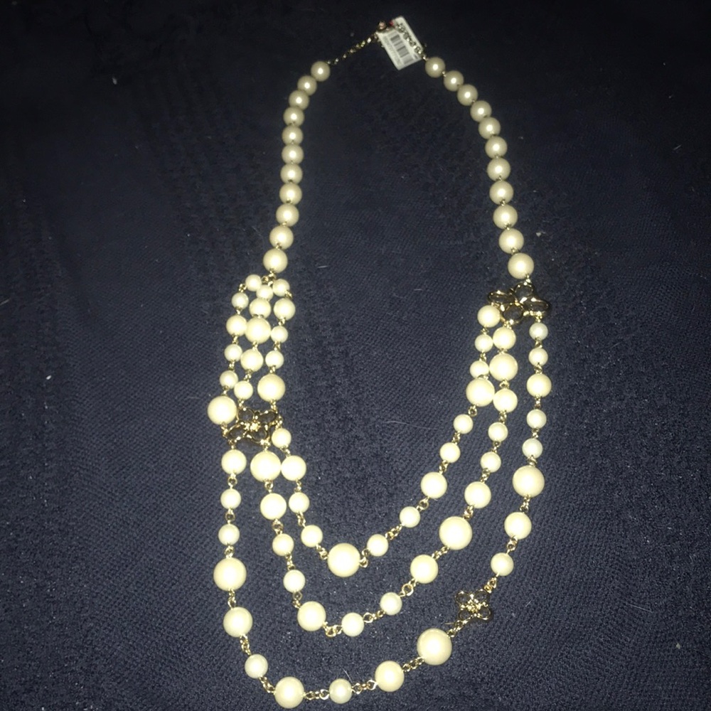 Elegant Ivory Multi-Strand Pearl Necklace with Gold Accents